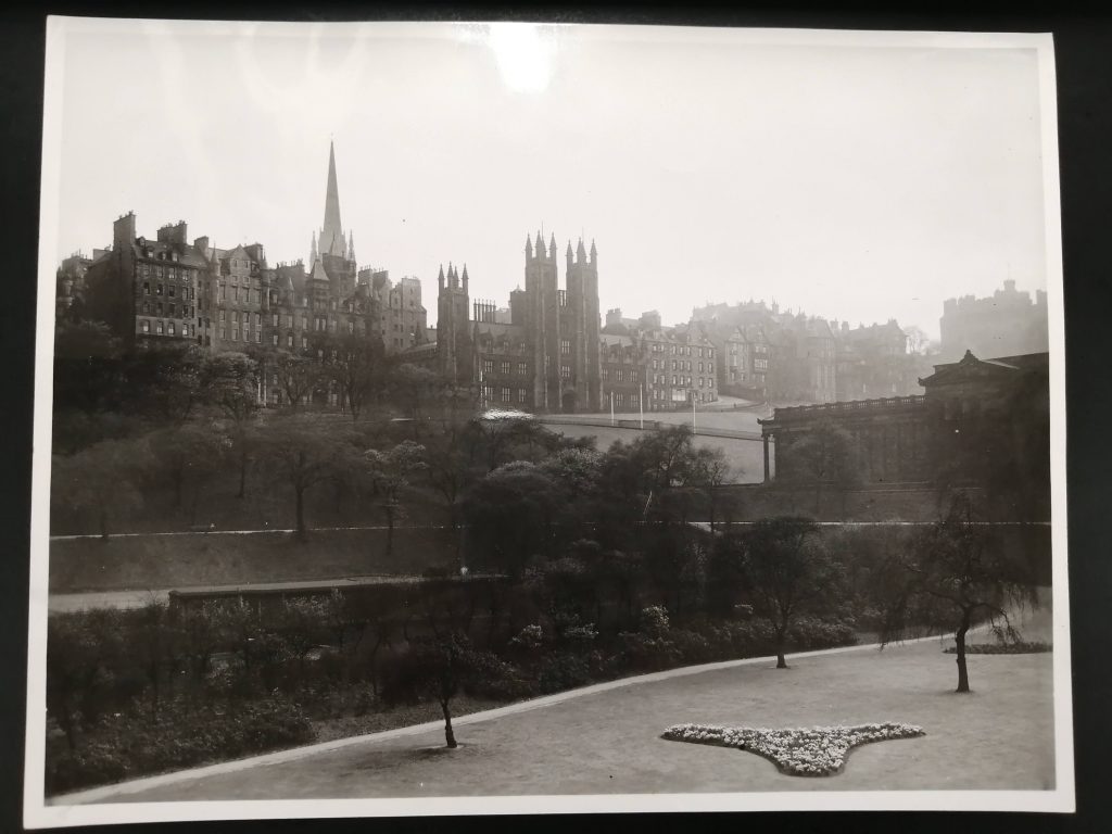 Black and white photo of New College from Princes Street Gardens in 1946