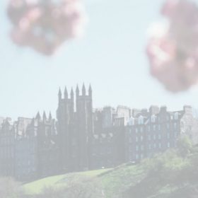 Faded colour photo of New College at the top of the mound, taken from Princes Street